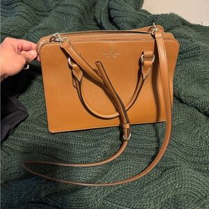 Brand new kate spade purse, two size handle/ strap. Never been used.